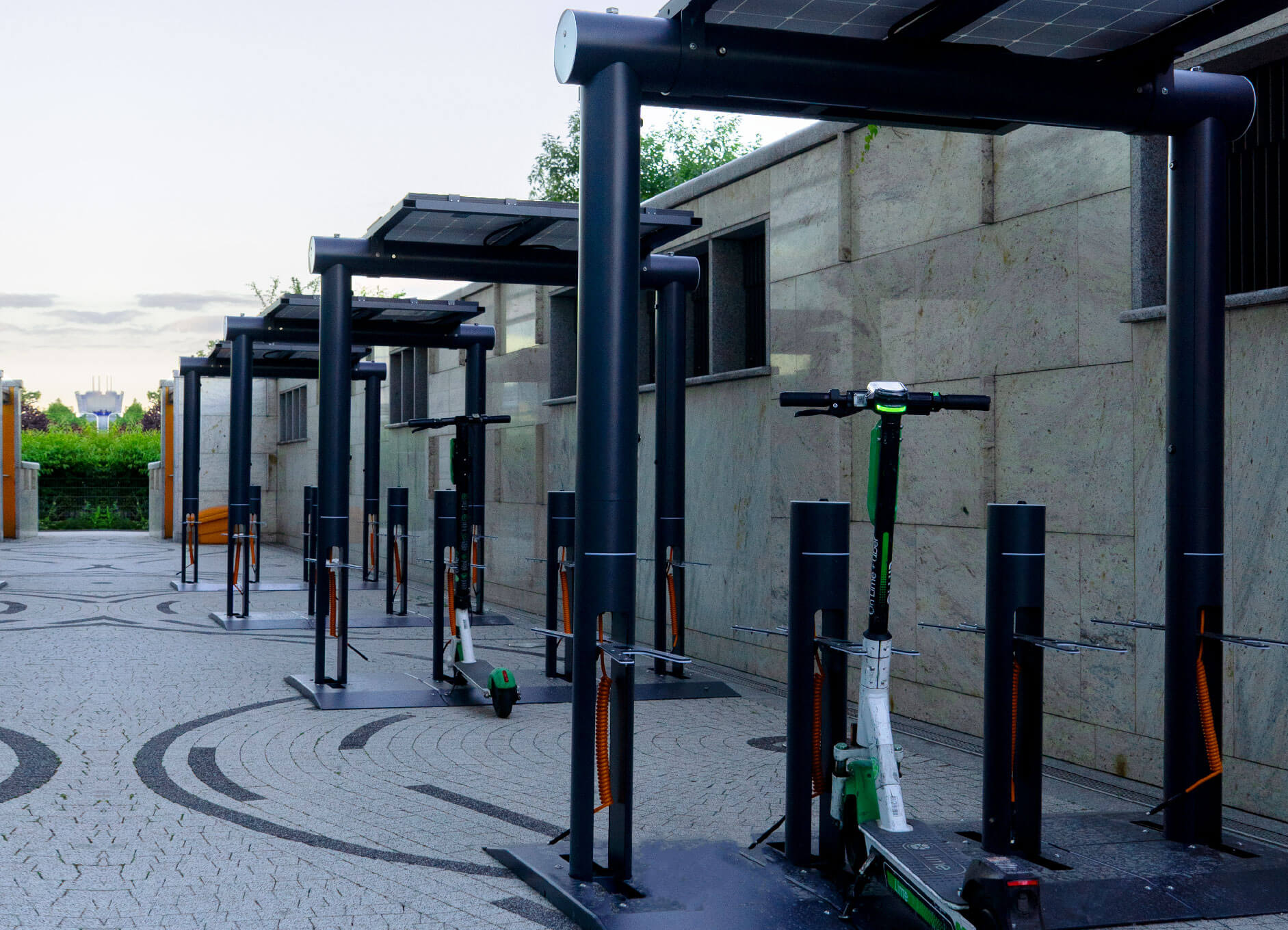 Four solar scooter charging stations